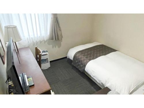 Postelja oz. postelje v sobi nastanitve Takatsuki W&M Hotel - Vacation STAY 48509v