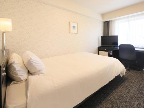 Tempat tidur dalam kamar di Richmond Hotel Nagoya Nayabashi