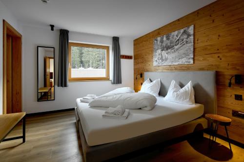 Cama ou camas em um quarto em Belvedere - Alpin-Resort Montafon Haus 3 by Pferd auf Wolke