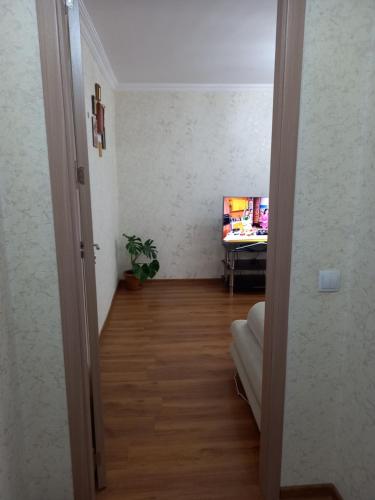 an open door to a hallway with a desk in a room at Elos-Home in Tbilisi City