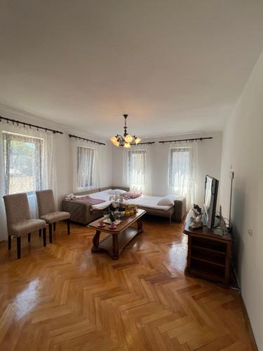 a living room with a couch and a table at City Heart Apartments in Ulcinj