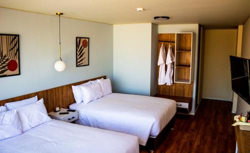 A bed or beds in a room at Hub Hotels Arequipa