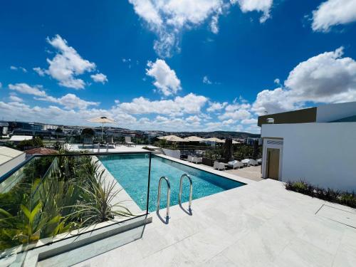 a swimming pool on the roof of a house at DIAGONAL HOTEL in Tangier