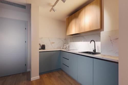 Una cocina o kitchenette en Syndicate Lodging Aparthotel