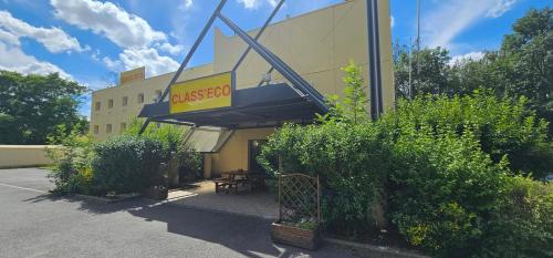 a restaurant with a sign on the side of a building at Class'eco Charleroi in Charleroi