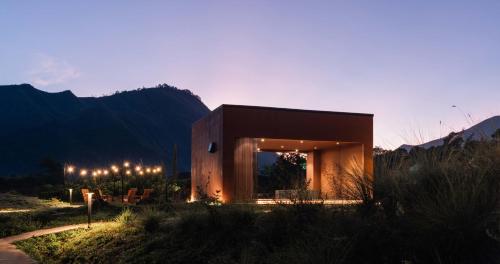 a small house in the middle of a field at Bobocabin Gunung Rinjani, Lombok in Sembalun Lawang