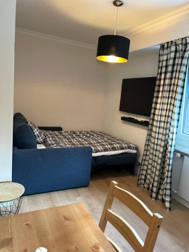 Cama ou camas em um quarto em Central Villars-sur-Ollon Apartment - for four 2 double beds