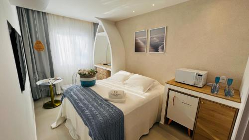 Una cama o camas en una habitación de D'Blue Búzios Hotel Boutique