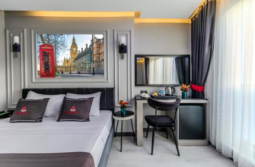 a hotel room with a bed and a red phone booth at Intercity Hotel Istanbul Airport in Arnavutköy