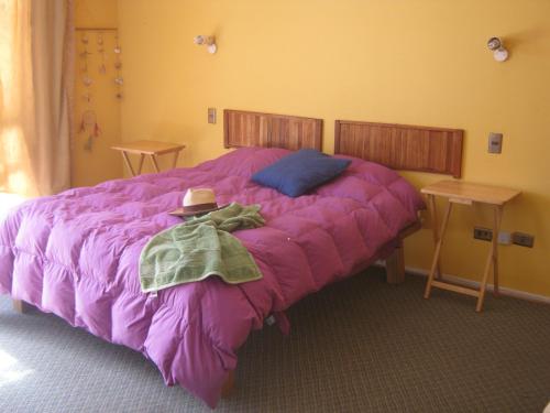 A bed or beds in a room at Cabañas Caleta San Pedro