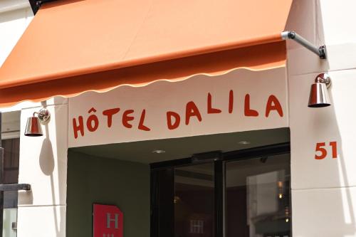 Et logo, certifikat, skilt eller en pris der bliver vist frem på Hôtel Dalila