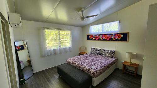 A bed or beds in a room at Aumaru Holiday Home