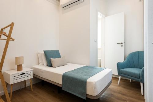 Krevet ili kreveti u jedinici u objektu Madalena Hostel e Suites