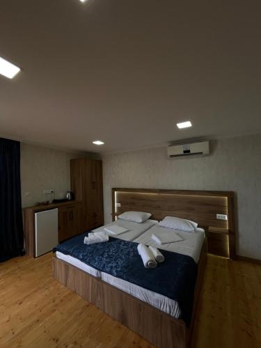 A bed or beds in a room at Panorama Bagrati