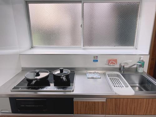 A kitchen or kitchenette at 大和戸建