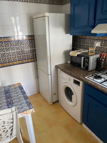 A cozinha ou cozinha compacta de Cosy appartement