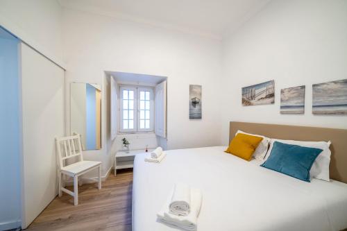 Cama ou camas em um quarto em Vila Olivença