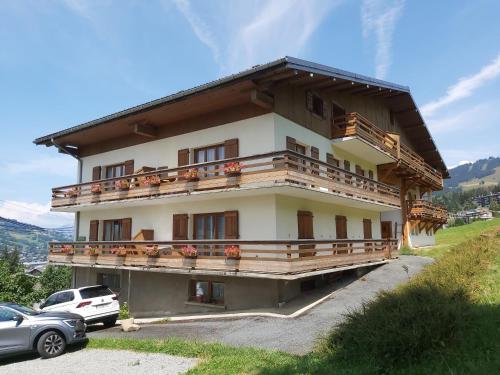 a building with balconies on the side of it at Chalet Monte-Pente in Megève