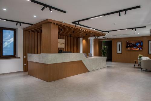 a lobby with a reception desk in a building at Silk Road Premium Hotel in Tashkent