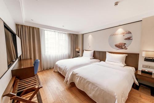 Krevet ili kreveti u jedinici u okviru objekta Guangzhou City Join Hotel Shipai Qiao metro Branch