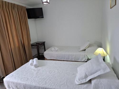 Giường trong phòng chung tại La Teresita Hotel Boutique