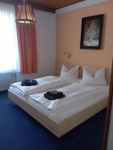 Postel nebo postele na pokoji v ubytování Hotel Burgwald