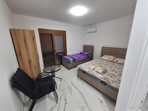 A bed or beds in a room at Kan&Dzan Apartmani