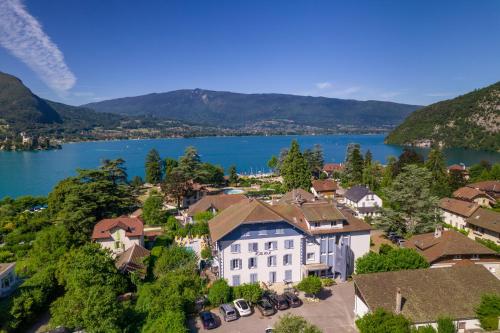 an aerial view of a town with a lake at Hotel du Lac in Talloires