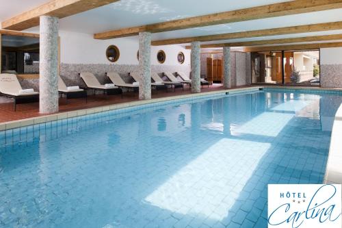 a swimming pool at a hotel entitled hotel citta at Beaulieu in La Clusaz