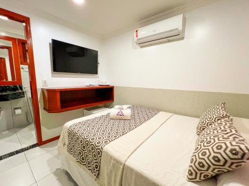 A bed or beds in a room at Mini Hotel Dunas