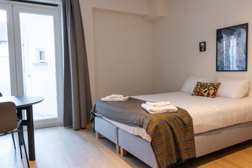 Giường trong phòng chung tại Smartflats - Leuven Central