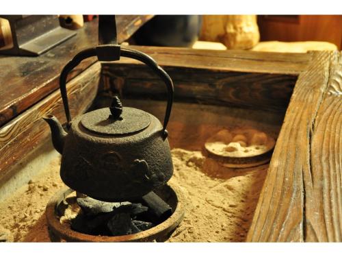 a teapot in a pot on a stove at Shinyu Onsen Kurikomaso - Vacation STAY 04615v in Kurihara