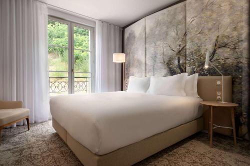 Cama ou camas em um quarto em Dolce by Wyndham Versailles - Domaine du Montcel