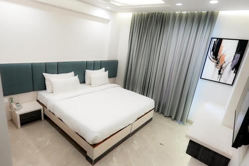 Katil atau katil-katil dalam bilik di Hotel Elinor By Dazzling Hotels & Resorts