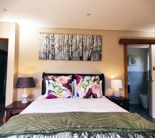 A bed or beds in a room at Cycad Place Midrand Guesthouse and B&B