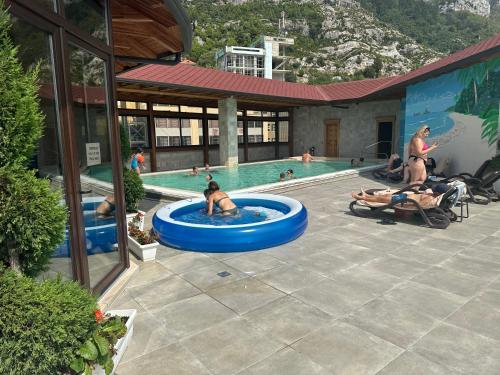 a group of people in a pool at a resort at Hotel PANORAMA Kruje view on the castle and the old town in Krujë