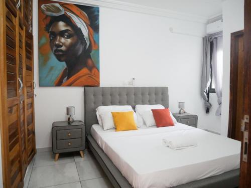 En eller flere senge i et værelse på Modern and Cosy Apt in Abidjan