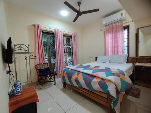 Krevet ili kreveti u jedinici u objektu GREENVIEW HOMESTAY KOVALAM