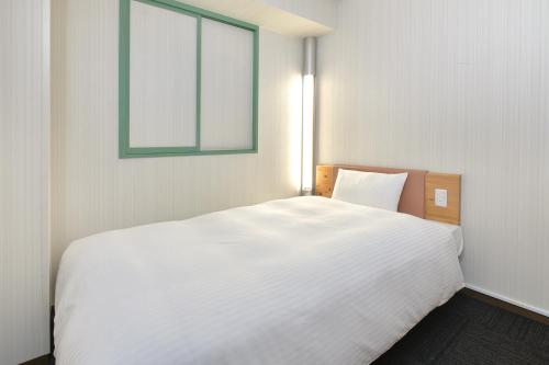 Postelja oz. postelje v sobi nastanitve R&B Hotel Kumagaya Ekimae