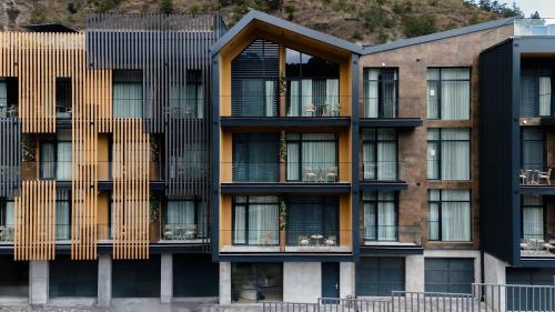 an external view of a building with balconies at Solridge Aparthotel in Tbilisi City