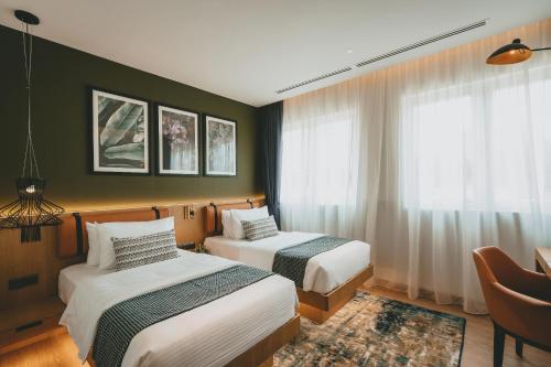 Krevet ili kreveti u jedinici u objektu Macalister Hotel Managed By The Ascott Limited