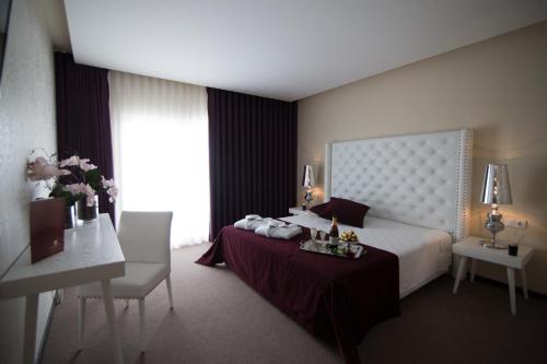 Vuode tai vuoteita majoituspaikassa Hotel de Ilhavo Plaza & Spa