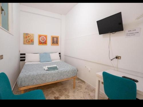 Cama ou camas em um quarto em L.T. Savoia Palace & Cavour C.L.