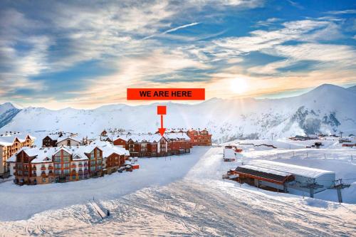 a resort in the snow with a sign that says we are here at PENTHOUSE BY GONDOLA 50 Meters, New Gudauri Suites in Gudauri