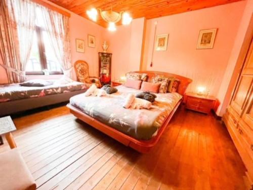 A bed or beds in a room at B&B Forêt d'Animaux