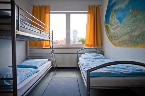 Una cama o camas en una habitación de Hostel Jena