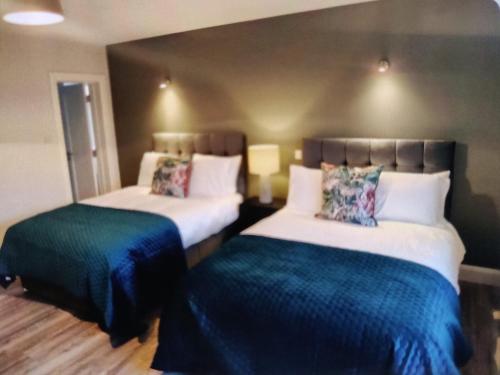 Lova arba lovos apgyvendinimo įstaigoje Luxury Guest house Claremorris