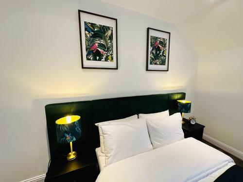 A bed or beds in a room at Barnet House Serviced Apartments