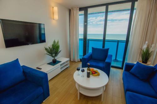 A television and/or entertainment centre at ORBI CITY King Suite Sea View