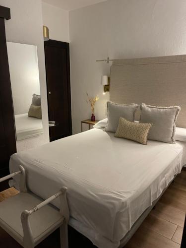 Vuode tai vuoteita majoituspaikassa HOTEL BOUTIQUE ALMA ANDALUSí